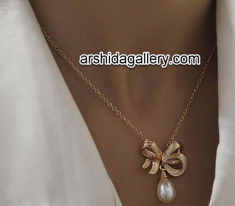 گردنبند زنانه جواهری مرواریدی طرح طلا پاپیونی با آبکاری طلای 18 عیار