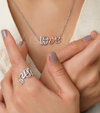 ست گردنبند و انگشتر استیل طرح Love با تزئینات سیاه و سفید مونوکروم و آبکاری رادیوم در آرشیدا گالری.