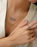 ست گردنبند و انگشتر استیل طرح Love با تزئینات سیاه و سفید مونوکروم و آبکاری رادیوم در آرشیدا گالری.